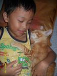 orange hugging my son while sleeping :)